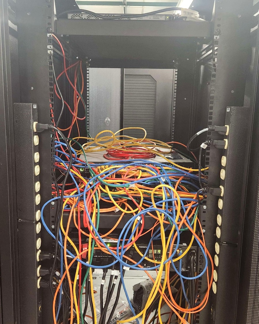 Network rack before cleanup and organization